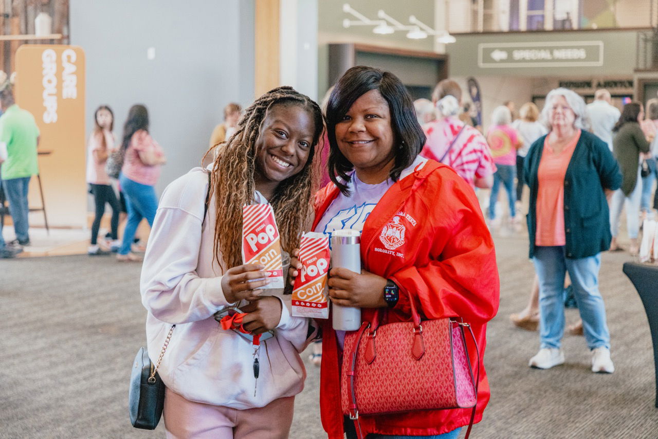 A group of friends talking and laughing together