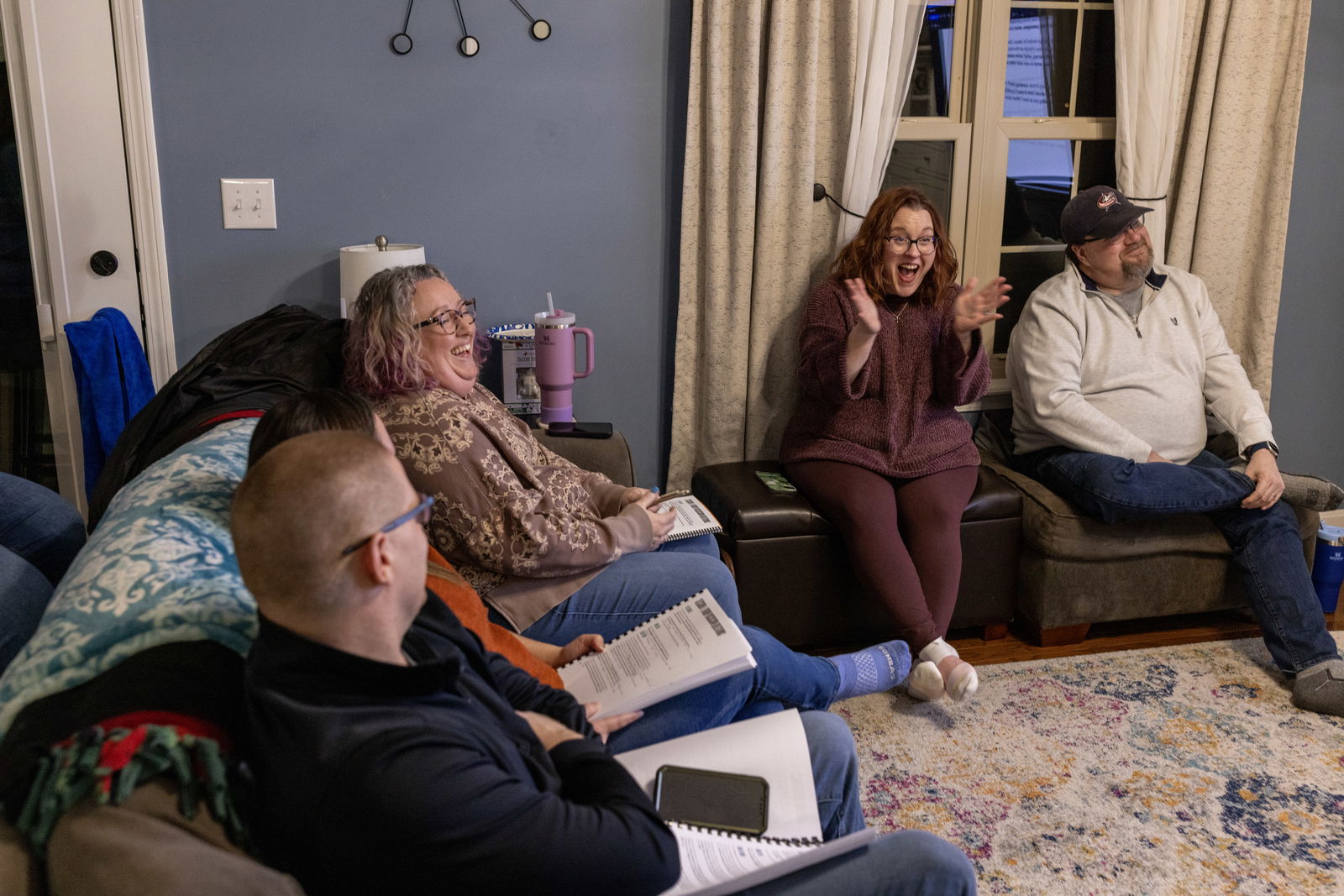 People gathered in a living room having a conversation